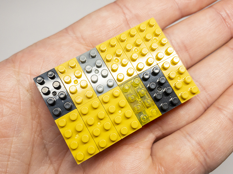 Top lid of the micro bricks enclosure with a yellow transparent brick