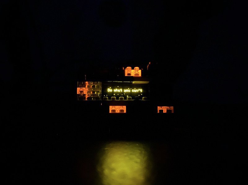 The finished device at night, glowing softly